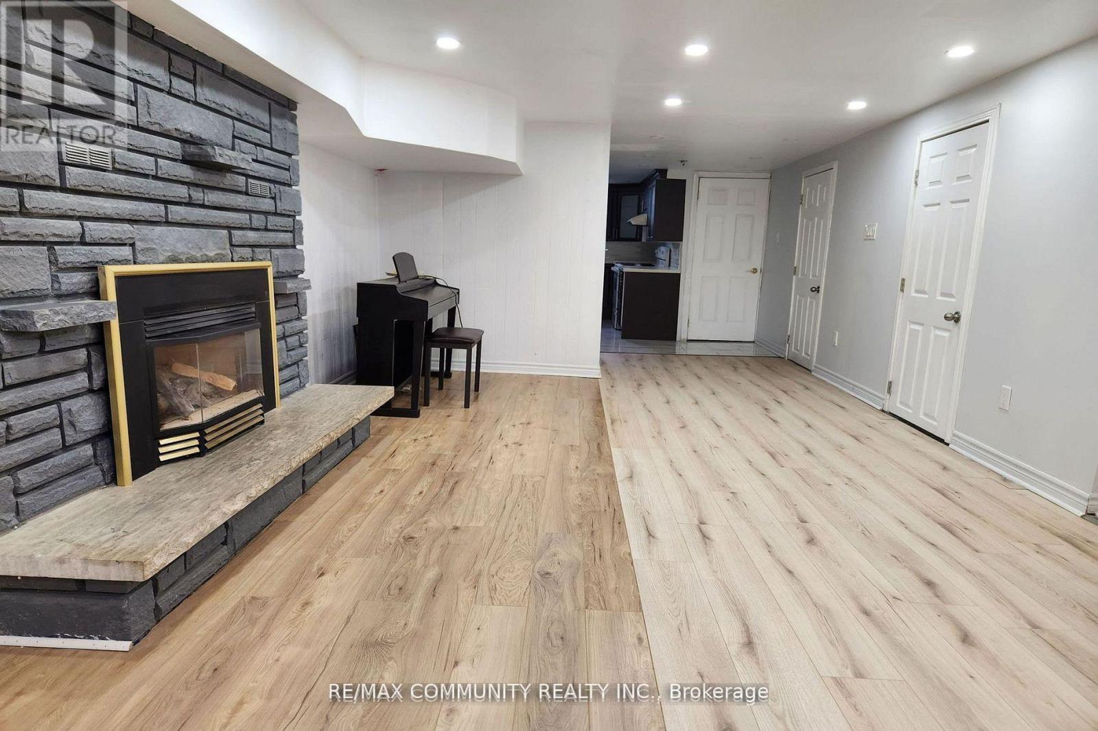 Bsmt - 315 Rossland Road W, Whitby, ON - Indoor With Fireplace