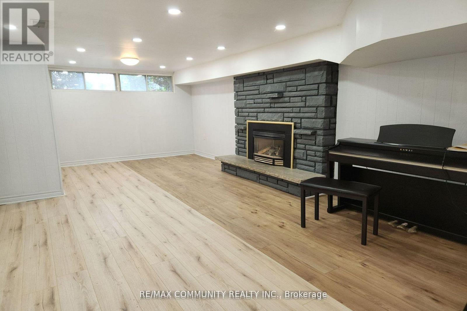 Bsmt - 315 Rossland Road W, Whitby, ON - Indoor With Fireplace