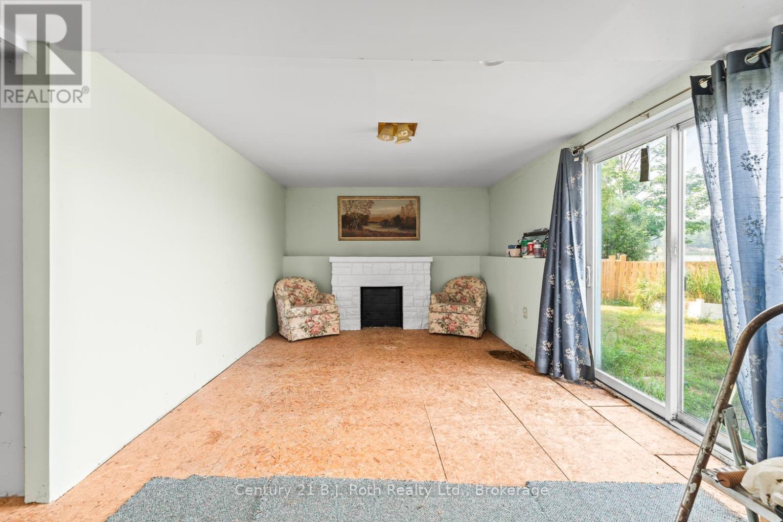 3338 Cox Drive, Severn, ON - Indoor With Fireplace