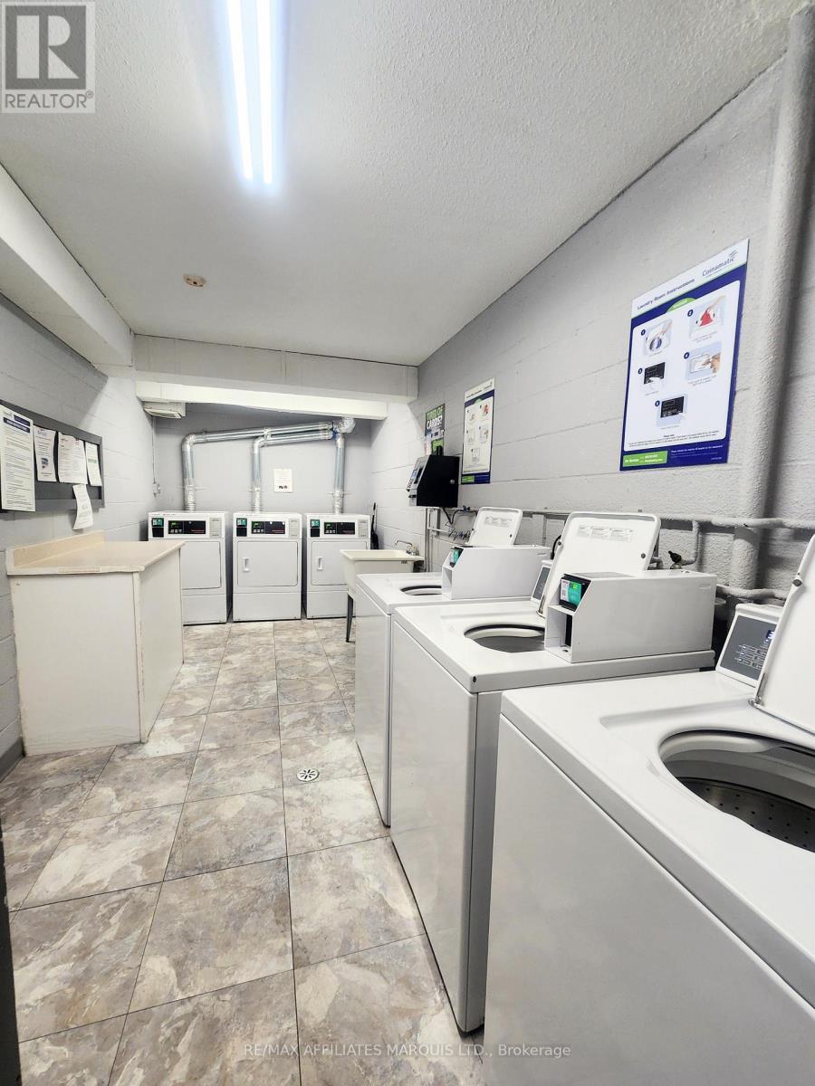 Shared Laundry in Building - 409 - 845 Kyle Court, Brockville, ON - Indoor Photo Showing Laundry Room