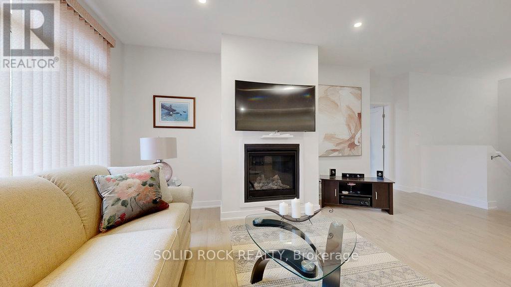 301 Wood Avenue, Smiths Falls, ON - Indoor Photo Showing Living Room With Fireplace