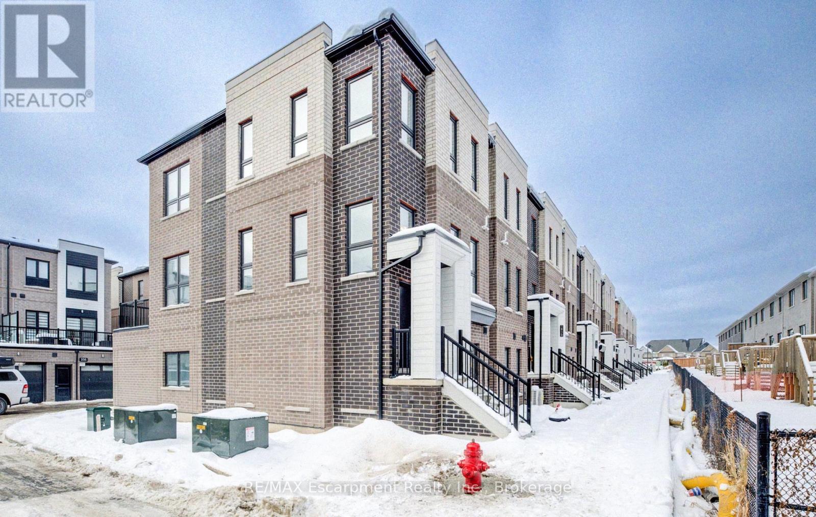 21 - 70 Kenesky Drive N, Hamilton (Waterdown), ON - Outdoor With Facade