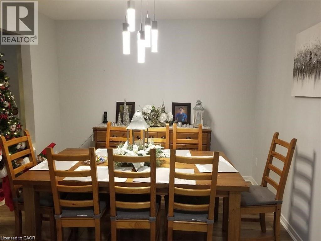 Dining area with wood finished floors - 185 Sulmona Drive, Hamilton, ON - Indoor Photo Showing Dining Room