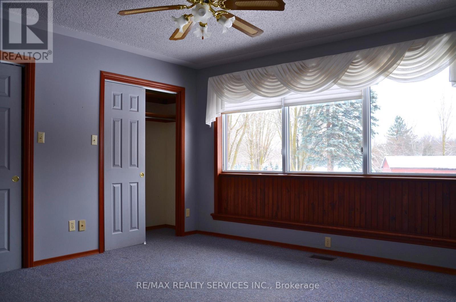 Primary His and Her Closets - 1045 Tremaine Avenue S, North Perth, ON - Indoor Photo Showing Other Room