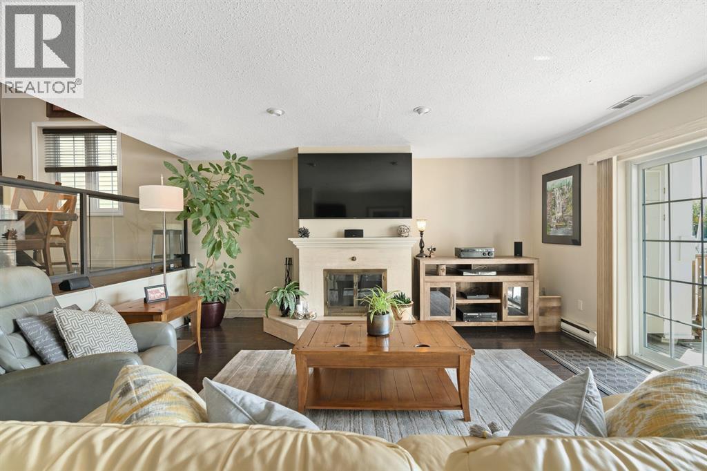 1500 Venetian Boulevard Unit# W-9, Point Edward, ON - Indoor Photo Showing Living Room With Fireplace