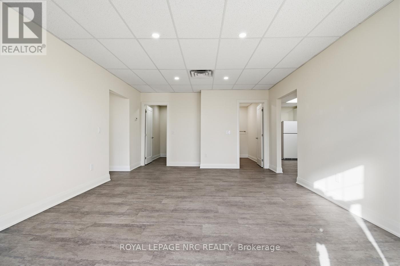 Living Room view to Bathrooms/Laundry - 201 - 431 St. Paul Street Street, St. Catharines (Downtown), ON