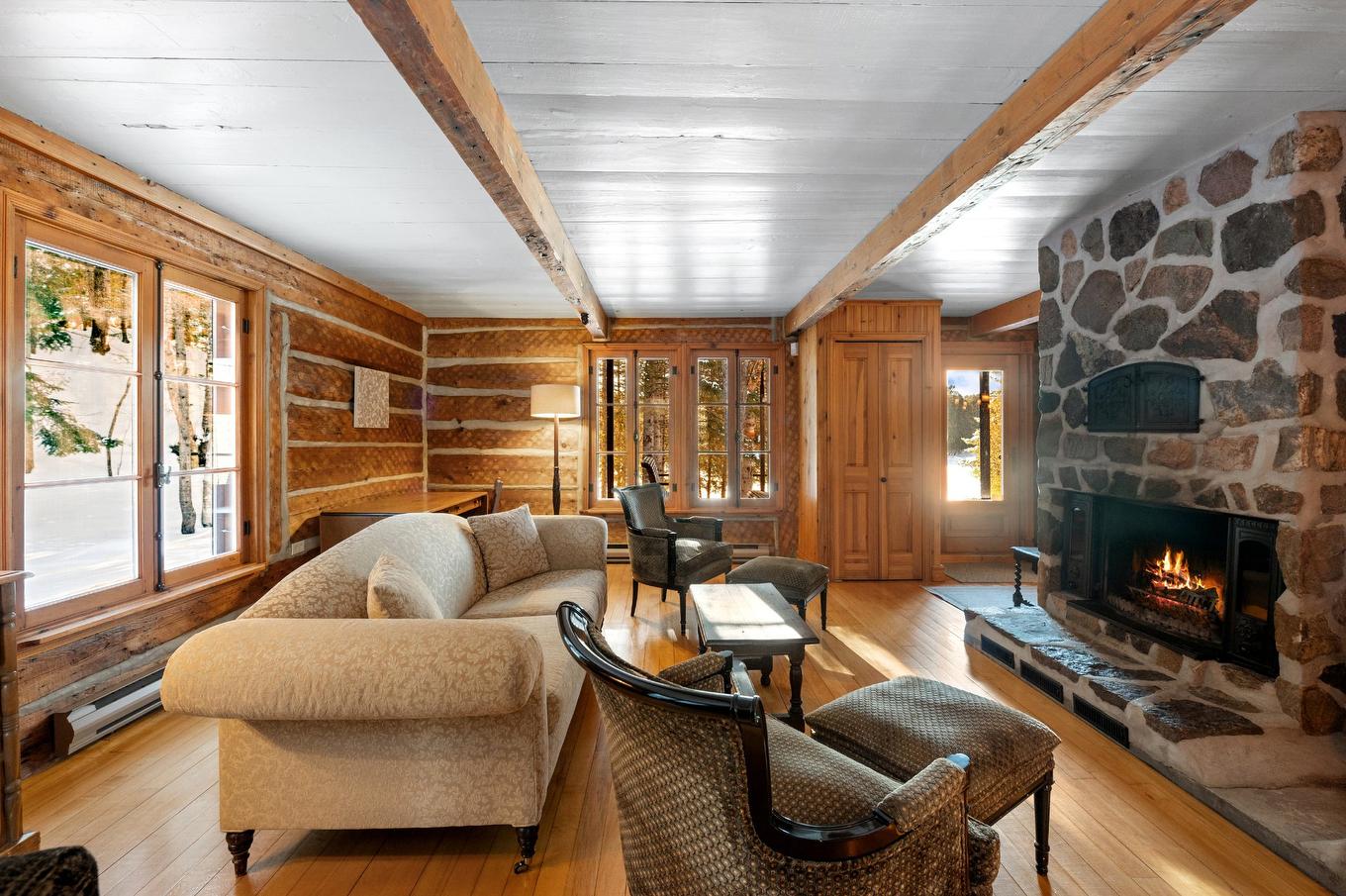 Living room - 1735 - 1737 Ch. De La Gare, Val-Morin, QC - Indoor Photo Showing Living Room With Fireplace