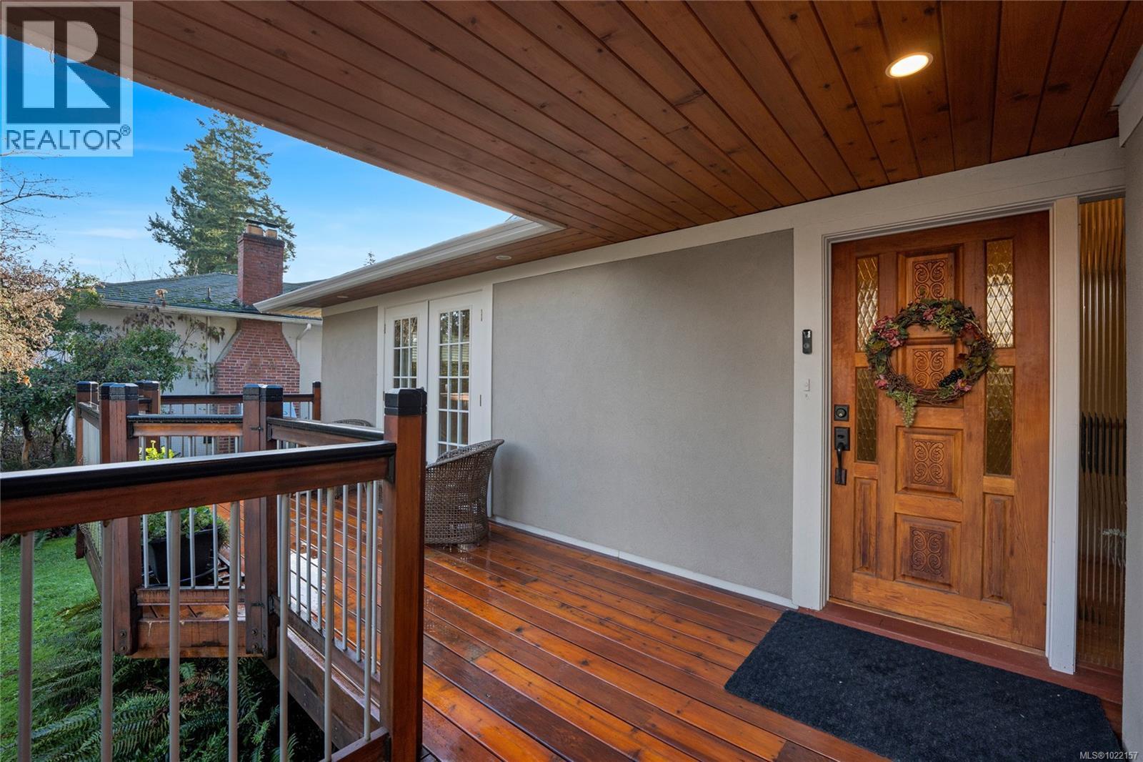 Wood deck and entrance to primary residence - 2229 Arbutus Rd, Saanich, BC - Outdoor With Deck Patio Veranda With Exterior