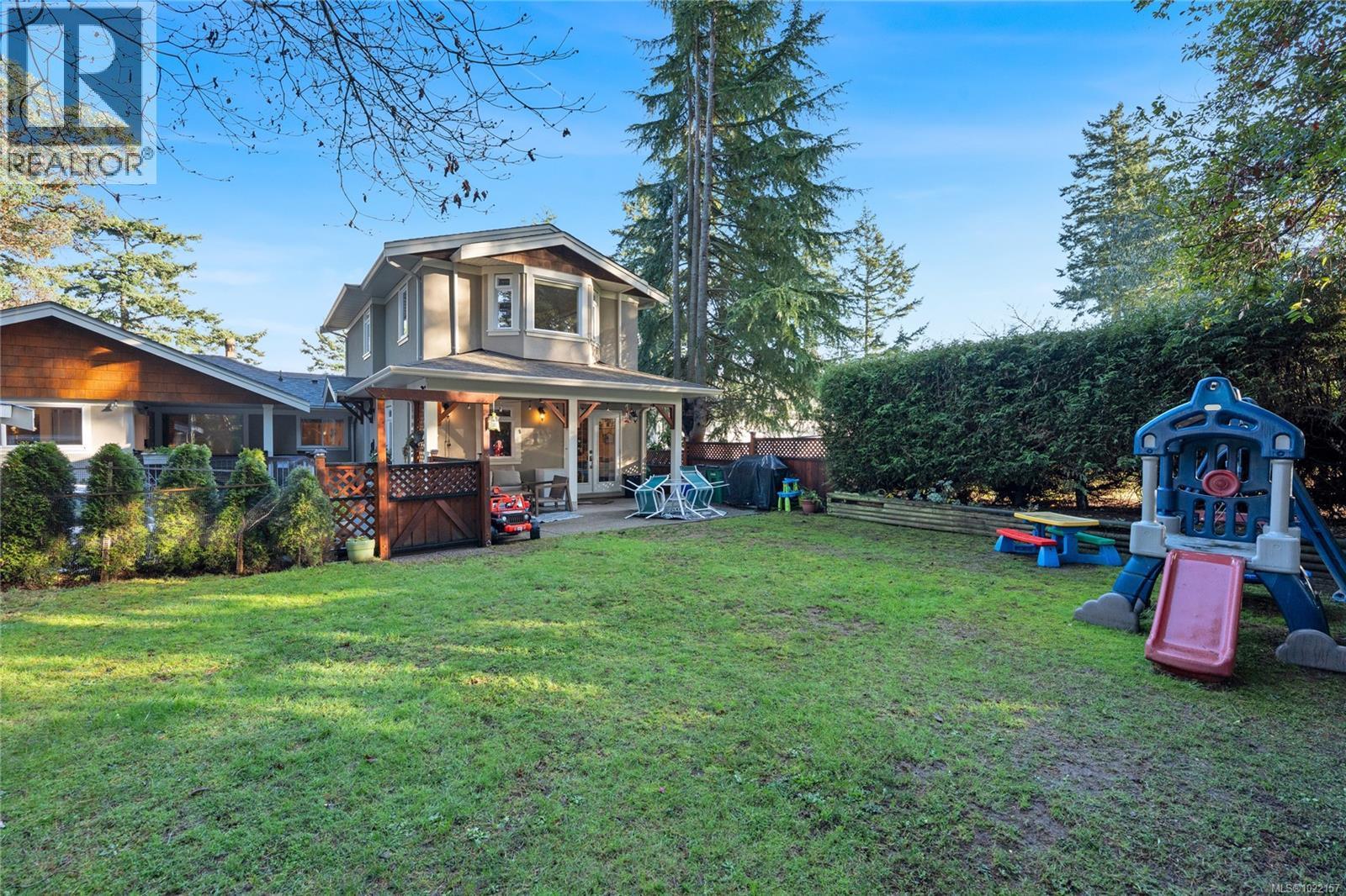 Back of cottage from yard - 2229 Arbutus Rd, Saanich, BC - Outdoor With Deck Patio Veranda