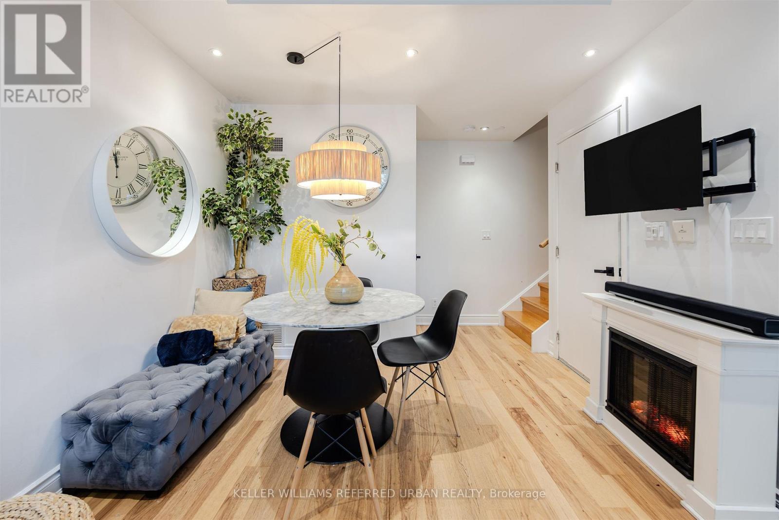 Th-115 - 90 Absolute Avenue, Mississauga, ON - Indoor Photo Showing Dining Room With Fireplace