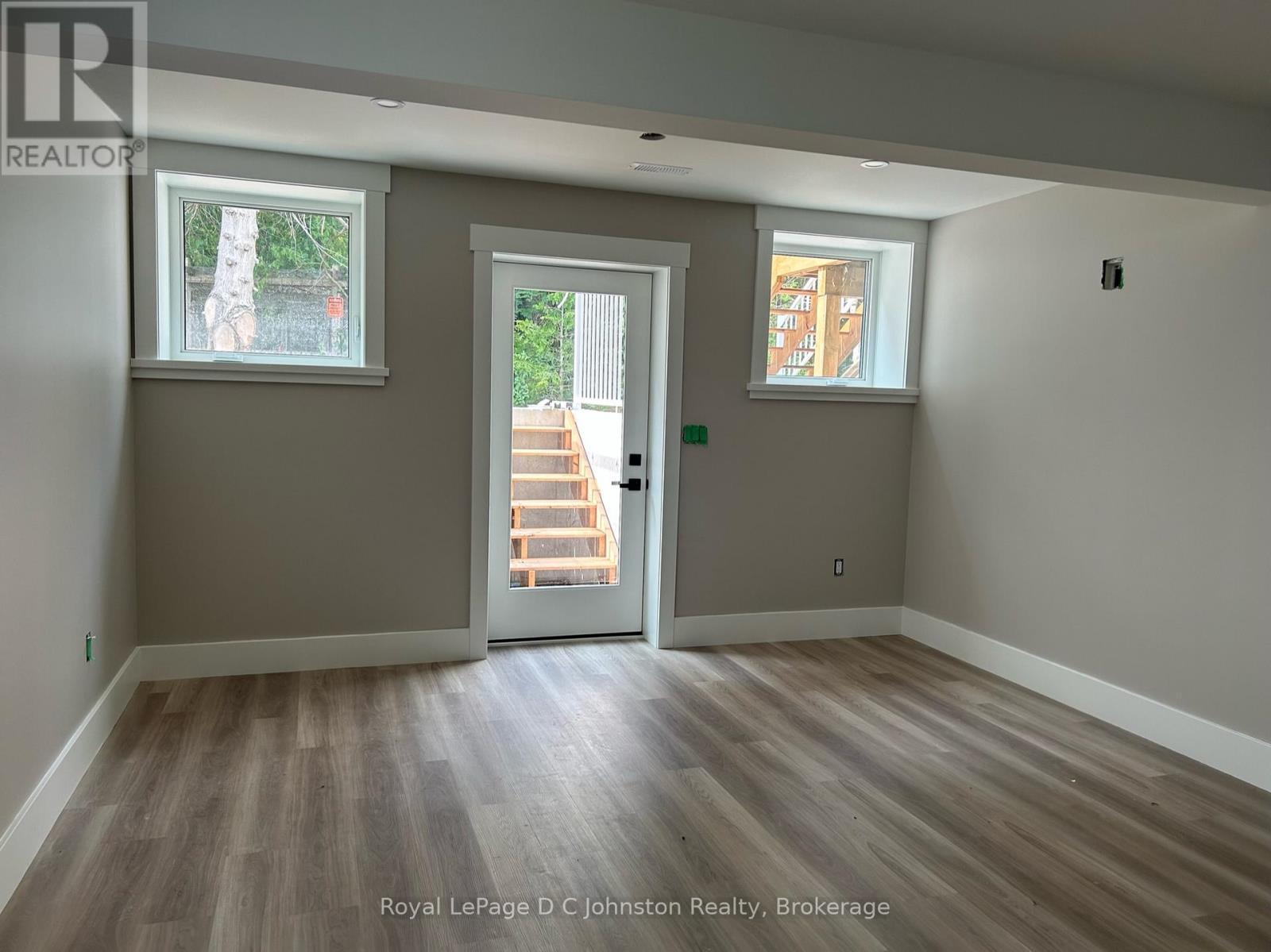 Living area with walk out to private outdoor patio - 2 - 242 South Rankin Street, Saugeen Shores, ON - Indoor Photo Showing Other Room
