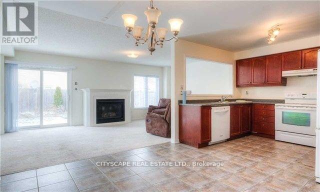 Upper - 5227 Tresca Trail, Mississauga, ON - Indoor Photo Showing Kitchen With Fireplace