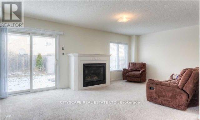 Upper - 5227 Tresca Trail, Mississauga, ON - Indoor Photo Showing Living Room With Fireplace