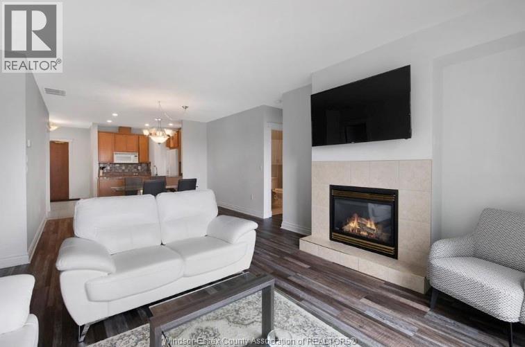 5055 Riverside Drive Unit# 201, Windsor, ON - Indoor Photo Showing Living Room With Fireplace
