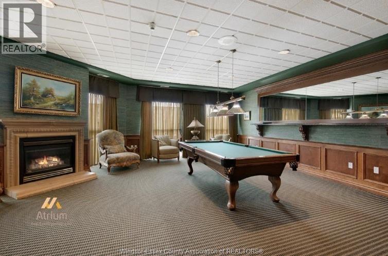 5055 Riverside Drive Unit# 201, Windsor, ON - Indoor Photo Showing Other Room With Fireplace