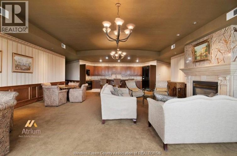 5055 Riverside Drive Unit# 201, Windsor, ON - Indoor Photo Showing Living Room With Fireplace