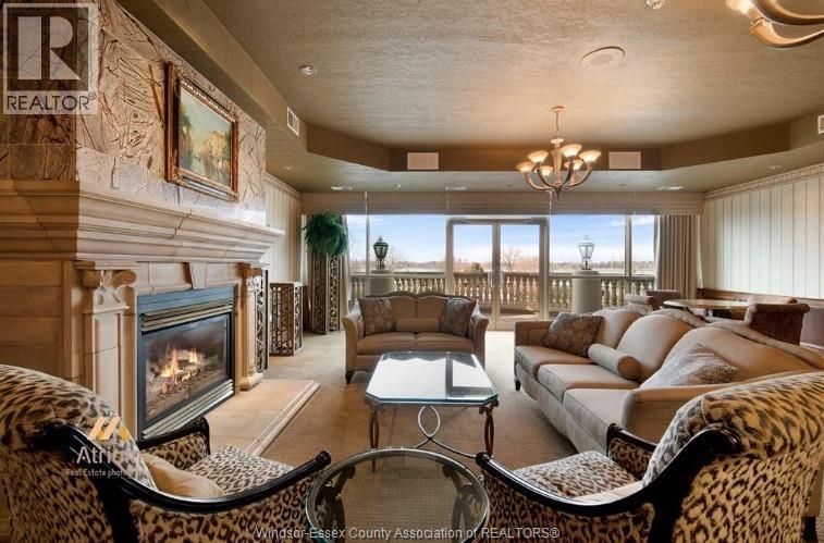 5055 Riverside Drive Unit# 201, Windsor, ON - Indoor Photo Showing Living Room With Fireplace