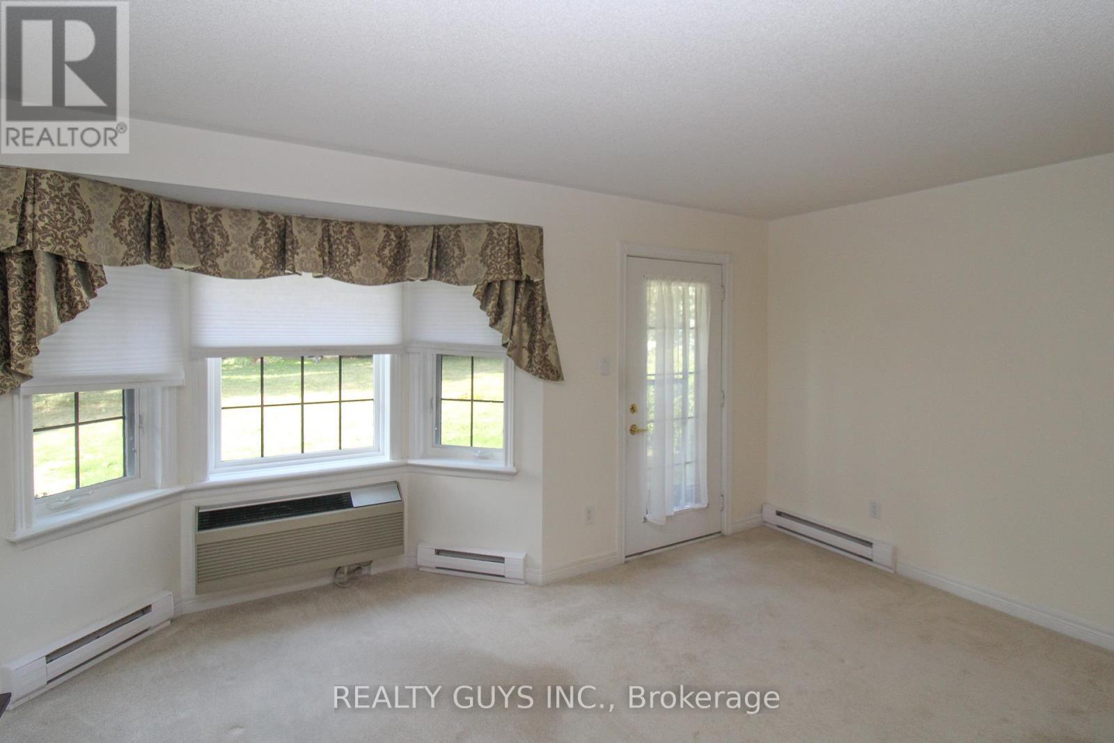 TO OUT SIDE PATIO - 4 - 693 Whitaker Street, Peterborough (Ashburnham Ward 4), ON - Indoor Photo Showing Other Room