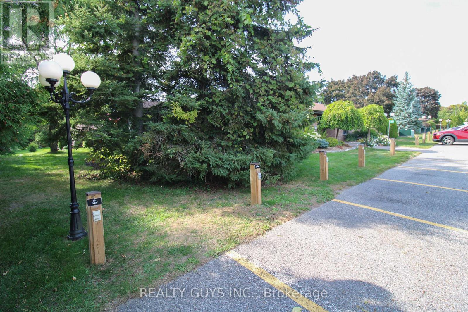 SUMMER PIC-VISITOR PARKING ON RIGHT - 4 - 693 Whitaker Street, Peterborough (Ashburnham Ward 4), ON - Outdoor