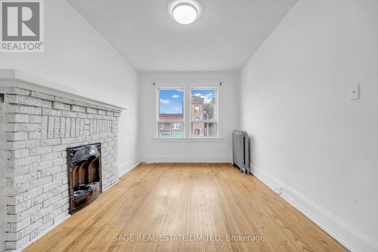 Upper - 1108 St. Clair Avenue W, Toronto, ON - Indoor With Fireplace