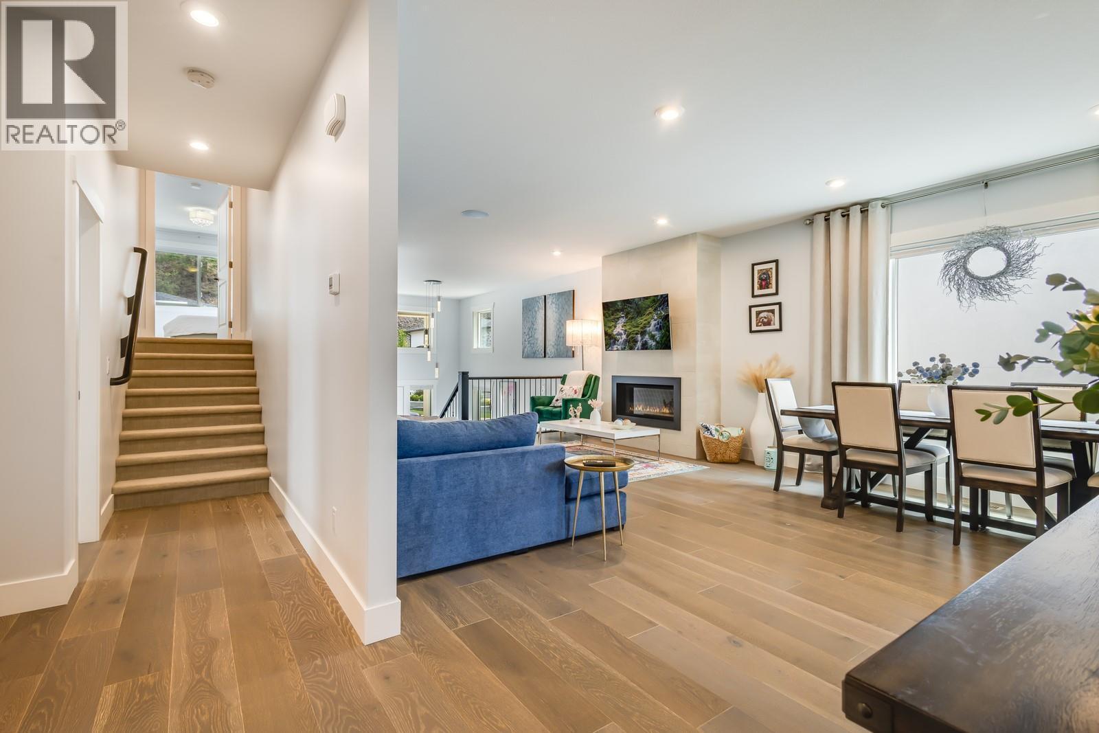 Primary bedroom loft accessed from the visible staircase - 3118 Riesling Way, West Kelowna, BC