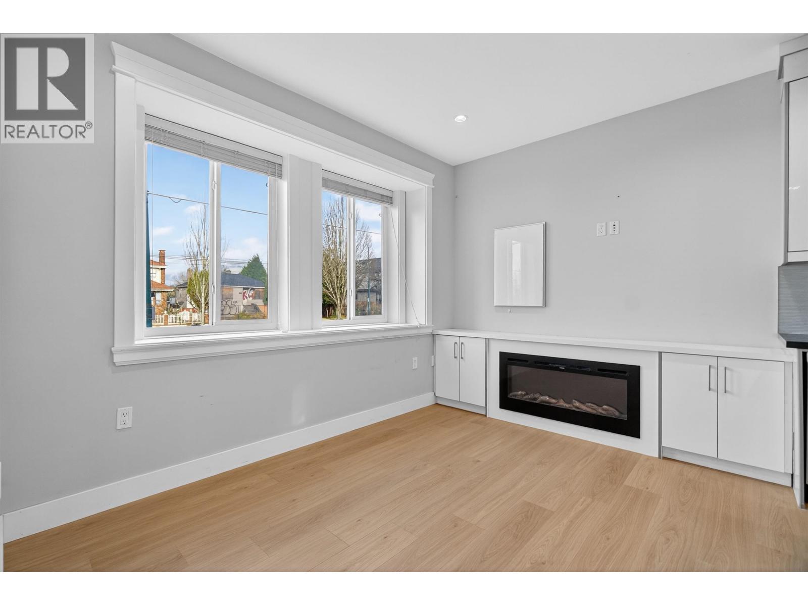 2430 E 41 Avenue, Vancouver, BC - Indoor Photo Showing Other Room With Fireplace