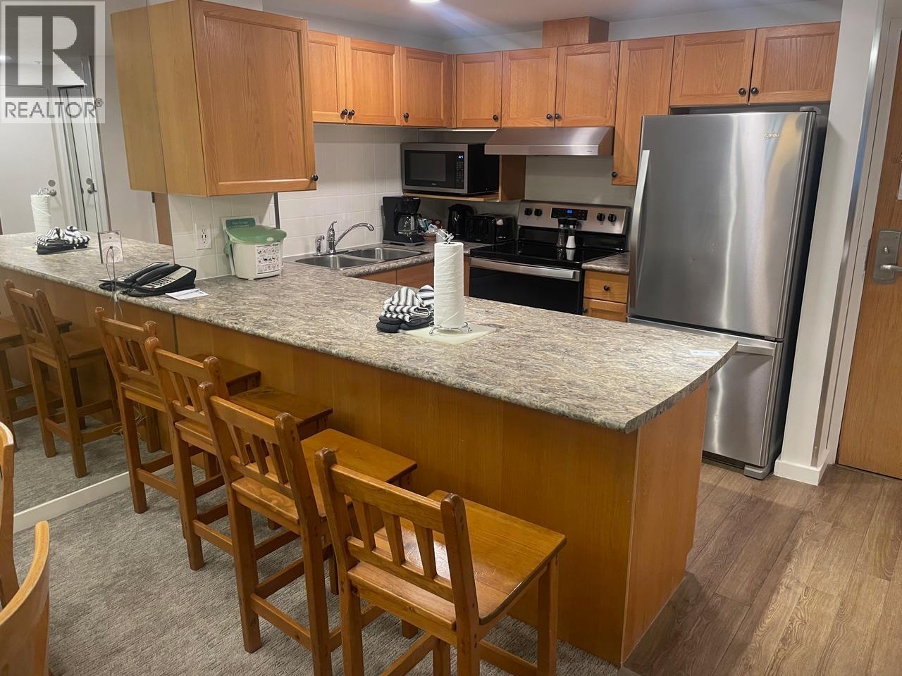 304 Week 2-4910 Spearhead Place, Whistler, BC - Indoor Photo Showing Kitchen With Double Sink