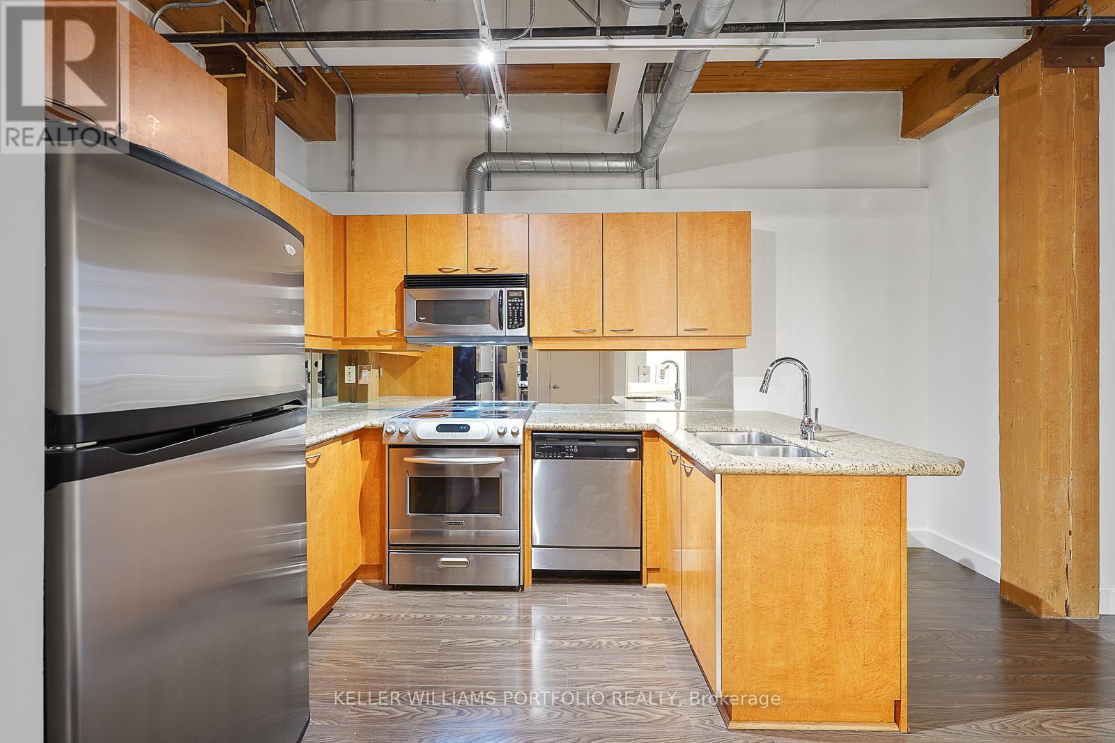 324 - 955 Queen Street W, Toronto, ON - Indoor Photo Showing Kitchen With Double Sink