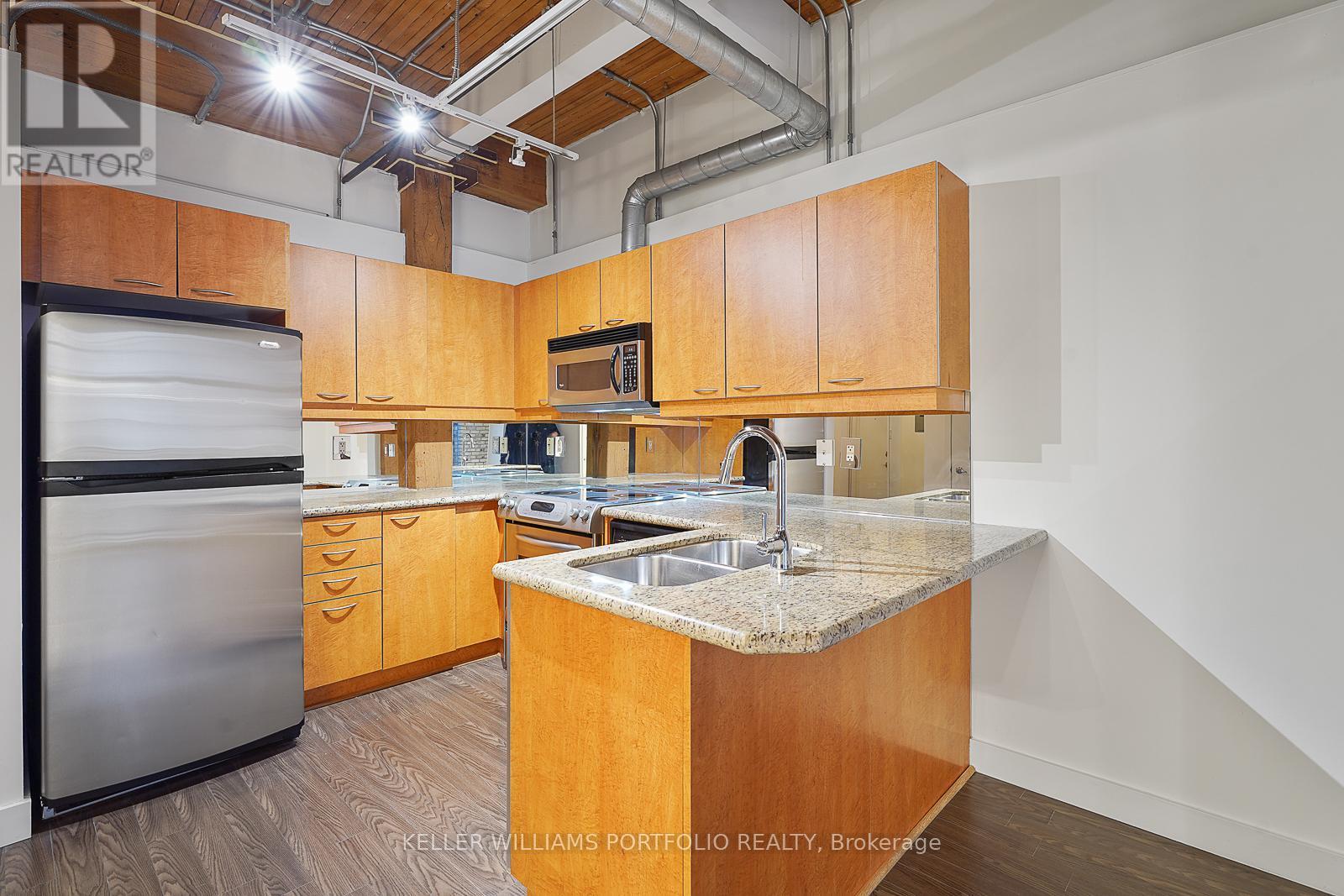 324 - 955 Queen Street W, Toronto, ON - Indoor Photo Showing Kitchen With Double Sink