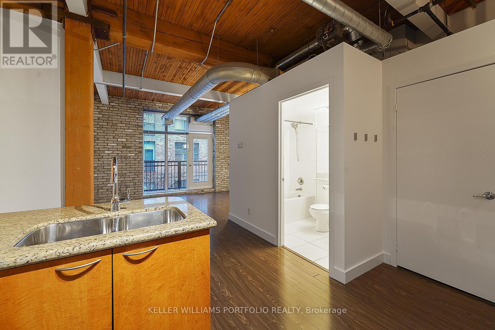 324 - 955 Queen Street W, Toronto, ON - Indoor Photo Showing Kitchen With Double Sink