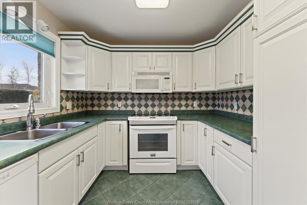 154 Purple Plum, Kingsville, ON - Indoor Photo Showing Kitchen With Double Sink