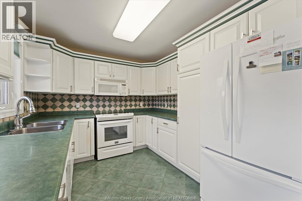154 Purple Plum, Kingsville, ON - Indoor Photo Showing Kitchen With Double Sink