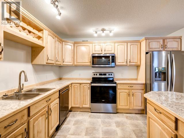49 Wyvern Avenue, Whitehorse, YT - Indoor Photo Showing Kitchen With Double Sink