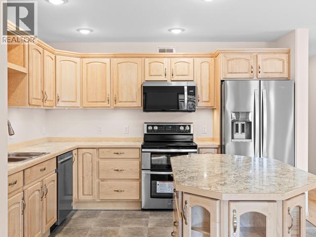 47 Wyvern Avenue, Whitehorse, YT - Indoor Photo Showing Kitchen With Double Sink