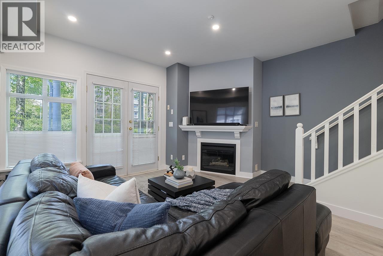 2880 E Kent Avenue South, Vancouver, BC - Indoor Photo Showing Living Room With Fireplace
