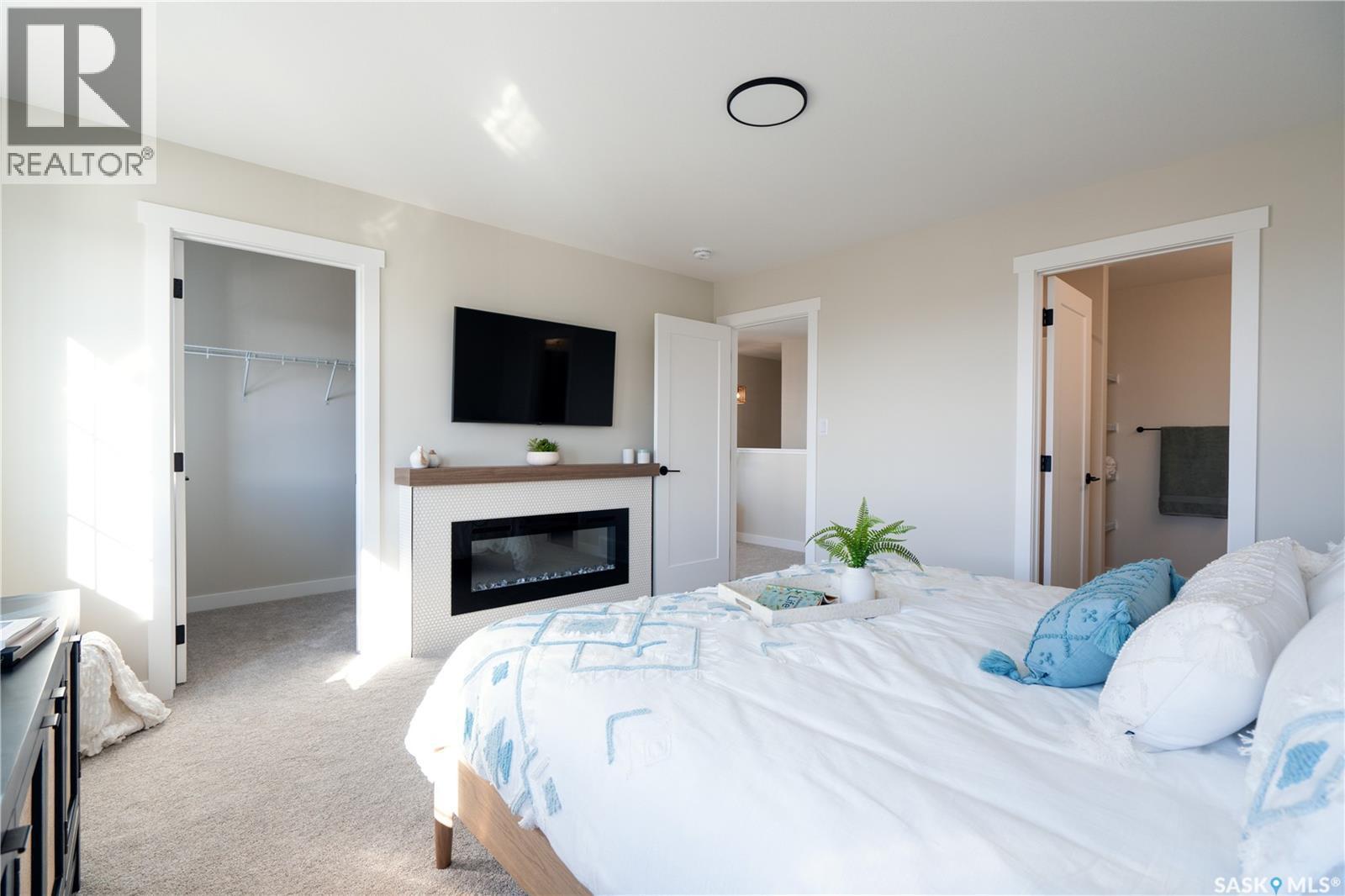 121 Yuel Crescent, Saskatoon, SK - Indoor Photo Showing Bedroom With Fireplace
