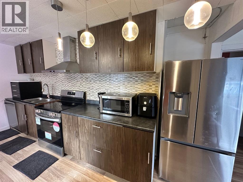 5302 50 Street, Camrose, AB - Indoor Photo Showing Kitchen With Double Sink