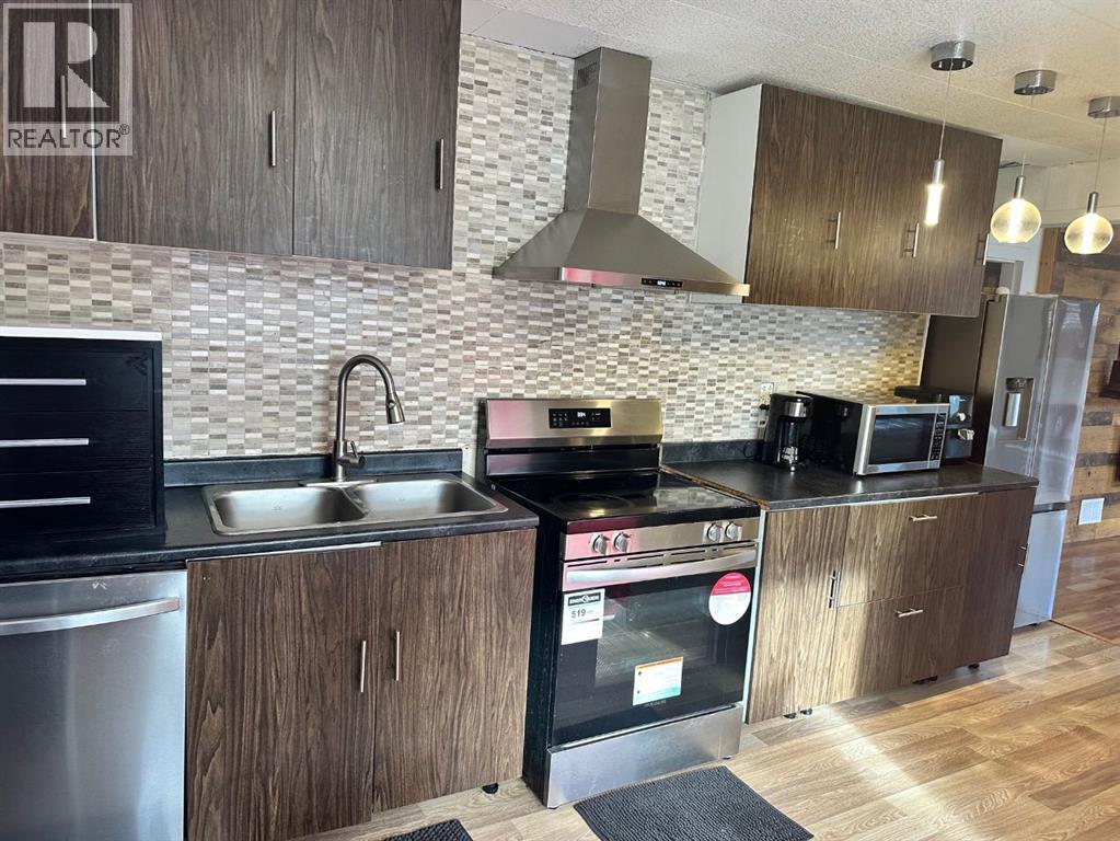 5302 50 Street, Camrose, AB - Indoor Photo Showing Kitchen With Double Sink