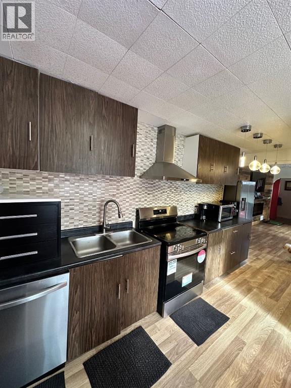 5302 50 Street, Camrose, AB - Indoor Photo Showing Kitchen With Double Sink