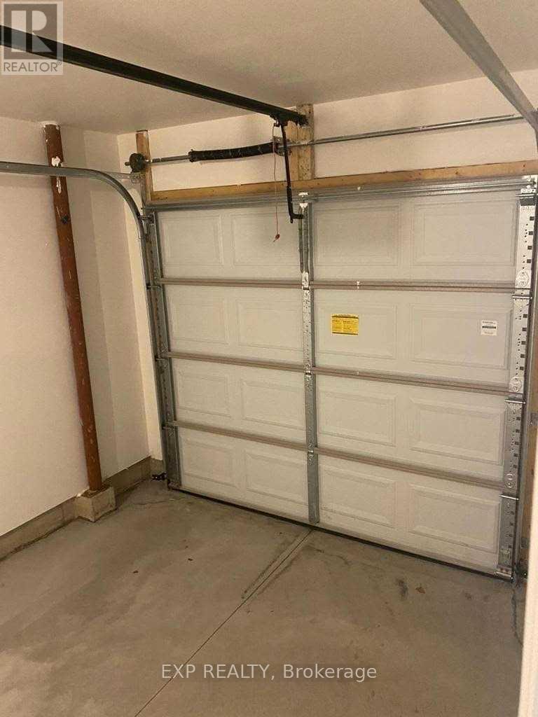 20 - 7945 Oldfield Road, Niagara Falls, ON - Indoor Photo Showing Garage