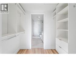 Primary bedroom walk in closet -