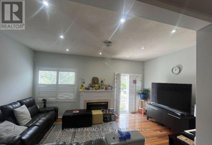6912 Buttle Station Place, Mississauga, ON - Indoor Photo Showing Living Room With Fireplace