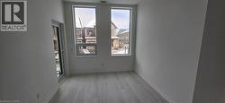 Unfurnished room featuring light hardwood / wood-style floors and a wealth of natural light -