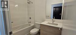 Full bathroom featuring washtub / shower combination, vanity, and toilet -