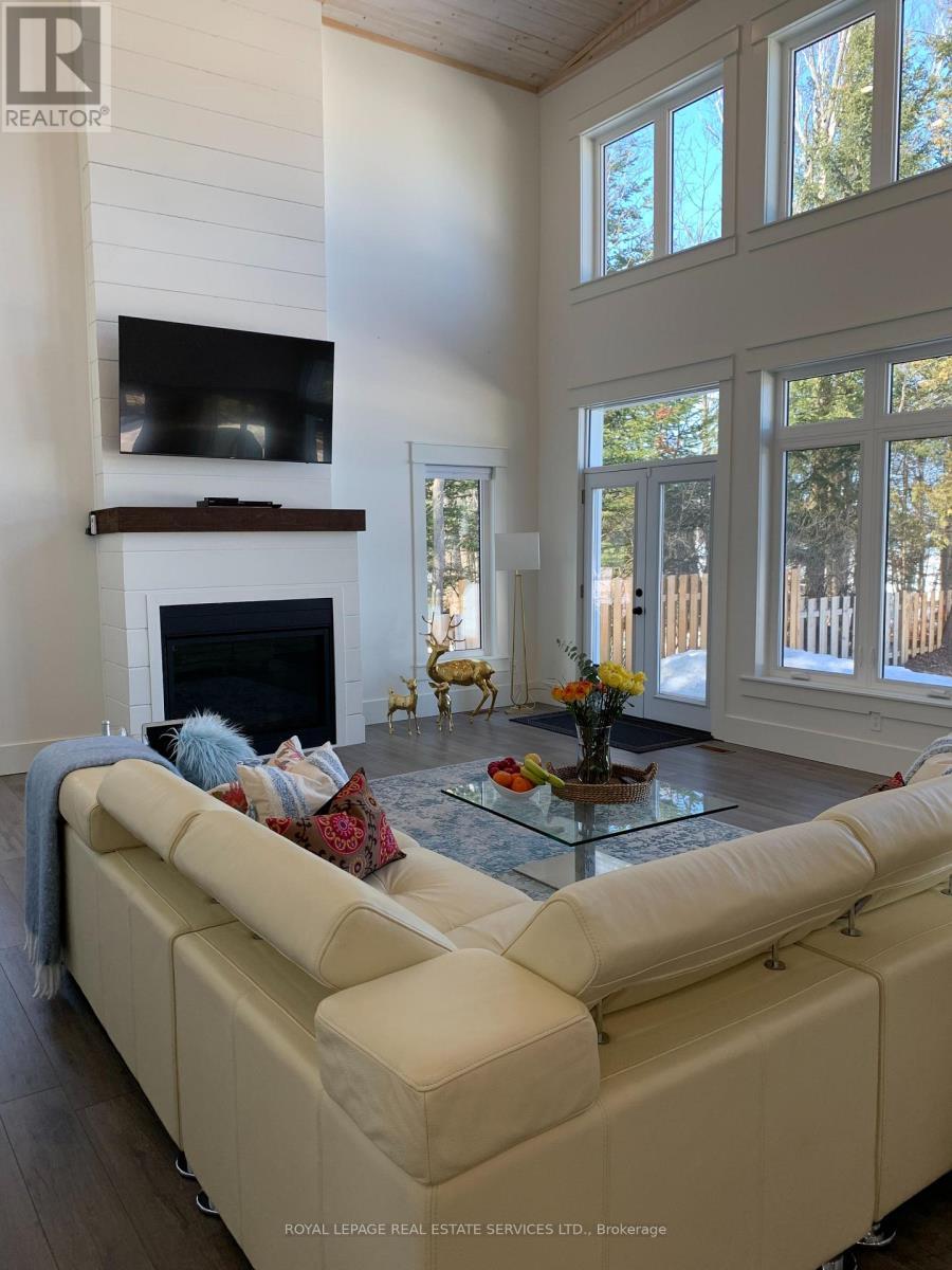4 Crescent Road, Strong, ON - Indoor Photo Showing Living Room With Fireplace