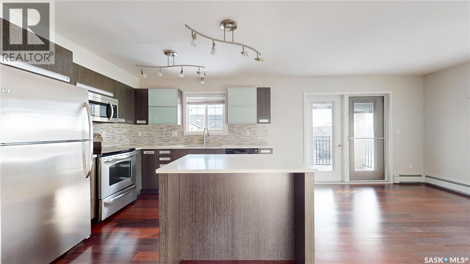 312 1510 Neville Drive, Regina, SK - Indoor Photo Showing Kitchen With Stainless Steel Kitchen With Upgraded Kitchen