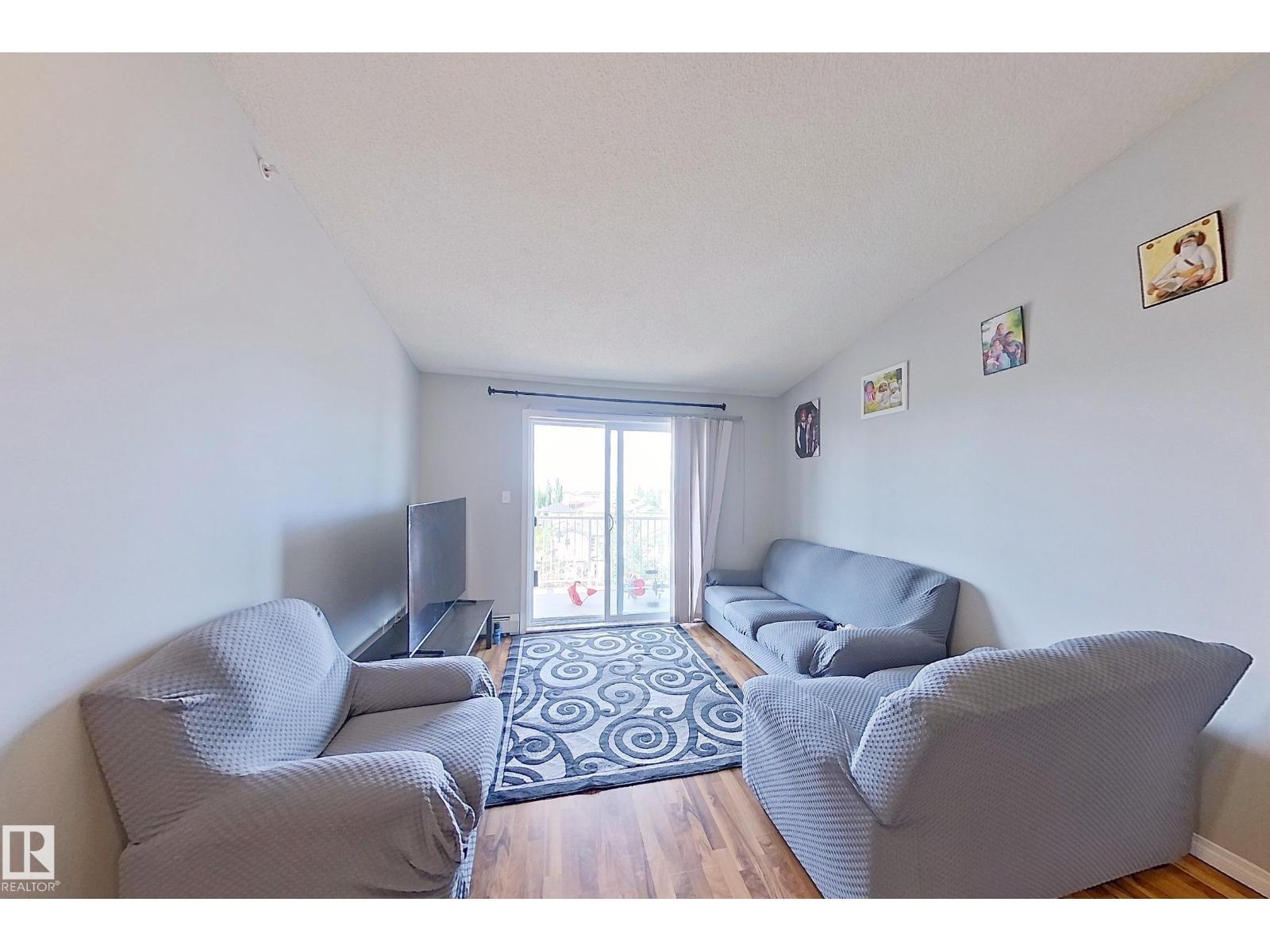 #418 3425 19 St Nw, Edmonton, AB - Indoor Photo Showing Living Room