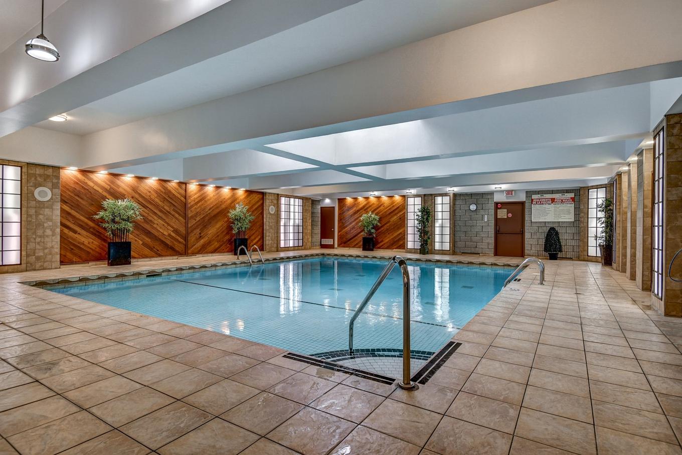 Piscine - 715-2555 Av. Du Havre-Des-Îles, Laval (Chomedey), QC - Indoor Photo Showing Other Room With In Ground Pool
