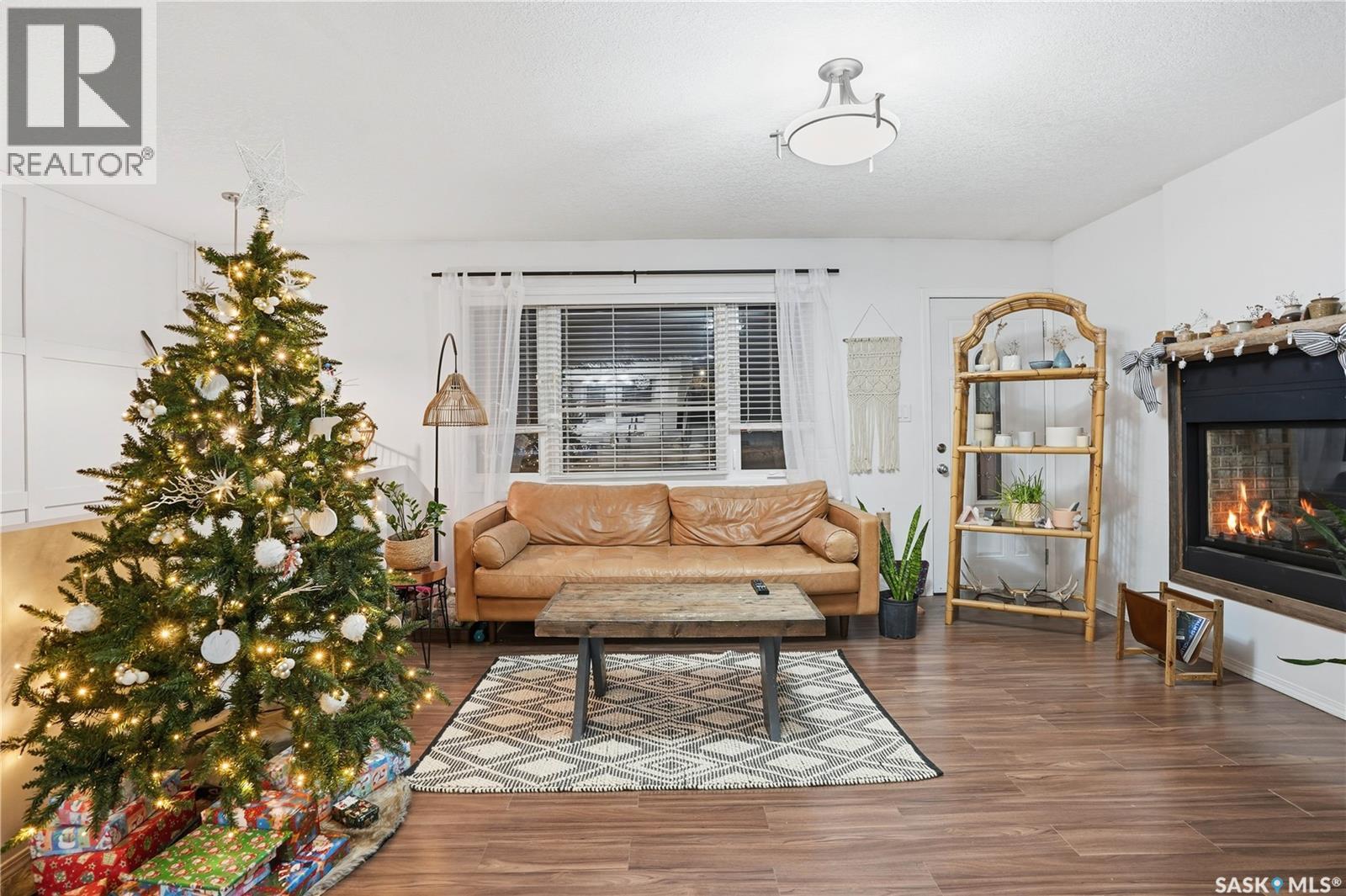 600 Mullin Avenue E, Regina, SK - Indoor Photo Showing Living Room With Fireplace