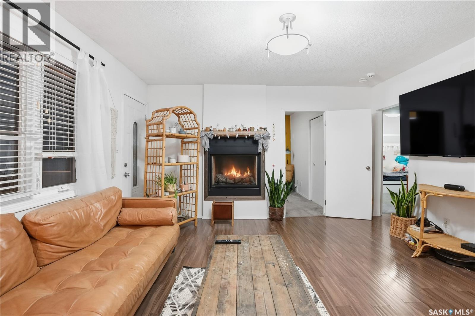 600 Mullin Avenue E, Regina, SK - Indoor Photo Showing Living Room With Fireplace